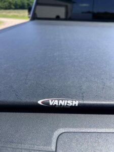 A close-up of a product labeled 'VANISH' on a surface.