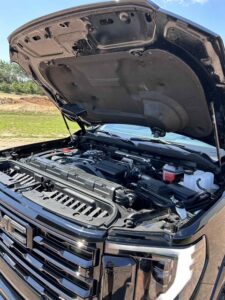 Open hood showing a clean, well-maintained car engine.