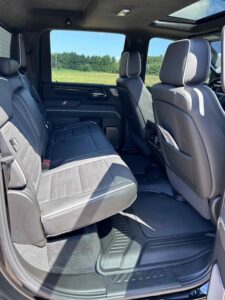 Spacious rear seats of a modern vehicle with ample legroom and black upholstery.