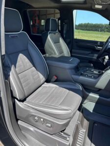 Close-up of modern car interior showing front seats and controls.